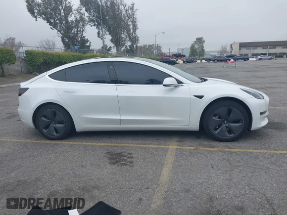 2020 Tesla Model 3 Long Range with VIN 5YJ3E1EB0LF803217, listed as a IAAI auction lot 41871940 with 130,391 mi miles. Bid and sale history available at carsss.com. Image 13.