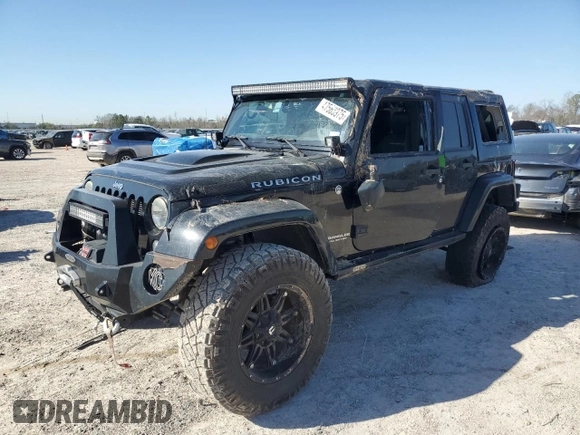2015 Jeep Wrangler Unlimited Rubicon Hard Rock with VIN 1C4HJWFG1FL710264, listed as a Copart auction lot 47563975 with 96,737 mi miles and Salvage title. Bid and sale history available at DreamBid. Image 1.