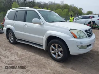 2004 Lexus GX 470 with VIN JTJBT20X440062559, listed as a IAAI auction lot 42142442 with 261,126 mi miles. Bid and sale history available at carsss.com. Image 1.