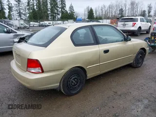 2002 Hyundai Accent GL with VIN KMHCG35CX2U199532, listed as a IAAI auction lot 41839270 with 200,232 mi miles. Bid and sale history available at carsss.com. Image 4.