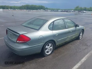 2005 Ford Taurus SE with VIN 1FAFP53U55A209369, listed as a IAAI auction lot 42144800 with 152,446 mi miles. Bid and sale history available at carsss.com. Image 4.