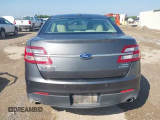 2015 Ford Taurus SEL z VIN 1FAHP2E80FG143819, wystawiony jako IAAI lot #42316114 z przebiegiem 103 959 mil mil oraz . Historia ofert i sprzedaży dostępna na DreamBid. Obrazek 16.