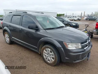 2014 Dodge Journey SE with VIN 3C4PDCABXET160224, listed as a IAAI auction lot 42724257 with 176,468 mi miles and . Bid and sale history available at DreamBid. Image 1.