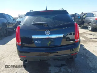 2014 Cadillac SRX Performance Collection z VIN 3GYFNCE35ES517868, wystawiony jako IAAI lot #41775522 z przebiegiem 166 960 mil mil oraz . Historia ofert i sprzedaży dostępna na DreamBid. Obrazek 16.