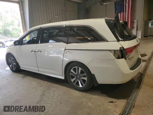 2016 Honda Odyssey Touring Elite with VIN 5FNRL5H91GB070424, listed as a Copart auction lot 55583075 with 115,709 mi miles and Salvage Title. Bid and sale history available at DreamBid. Image 2.