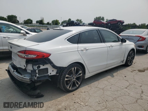 2019 Ford Fusion Titanium with VIN 3FA6P0K91KR217096, listed as a Copart auction lot 57796185 with 84,128 mi miles and Salvage title. Bid and sale history available at DreamBid. Image 3.