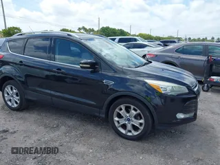 2015 Ford Escape Titanium with VIN 1FMCU0JX8FUC62035, listed as a IAAI auction lot 42106969 with 112,710 mi miles and . Bid and sale history available at DreamBid. Image 1.