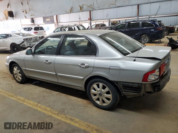 2005 Kia Optima LX z VIN KNAGD128155423463, wystawiony jako Copart lot #87441284 z przebiegiem 143 193 mil mil oraz Szkoda całkowita • Salvage title. Historia ofert i sprzedaży dostępna na DreamBid. Obrazek 2.