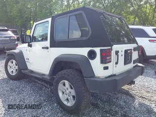 2009 Jeep Wrangler X with VIN 1J4FA24119L727658, listed as a IAAI auction lot 42372855 with 145,450 mi miles and . Bid and sale history available at DreamBid. Image 3.
