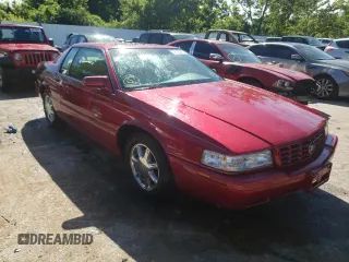 2000 Cadillac Eldorado Touring ETC z VIN 1G6ET129XYU191433, wystawiony jako Copart lot #58108224 z przebiegiem 76 957 mil mil oraz Szkody całkowita. Historia ofert i sprzedaży dostępna na DreamBid. Obrazek 4.