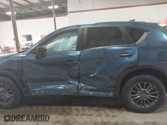 2019 Mazda CX-5 Touring with VIN JM3KFBCM1K0584369, listed as a IAAI auction lot 41657765 with 77,934 mi miles. Bid and sale history available at carsss.com. Image 14.
