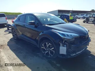 2020 Toyota C-HR LE with VIN JTNKHMBX9L1063563, listed as a IAAI auction lot 41986457 with 143,694 mi miles. Bid and sale history available at carsss.com. Image 1.