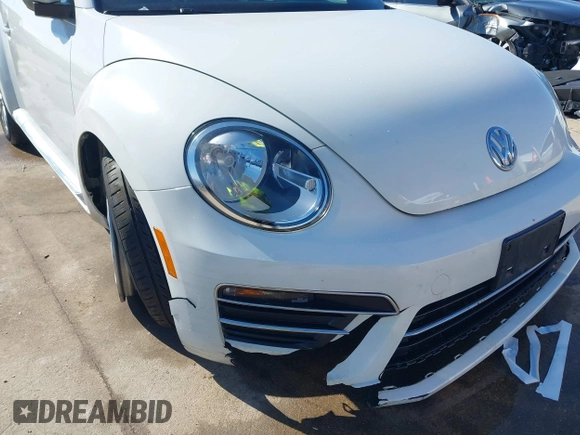 2019 Volkswagen Beetle S with VIN 3VW5DAAT0KM507437, listed as a IAAI auction lot 41380821 with 28,010 mi miles and . Bid and sale history available at DreamBid. Image 6.