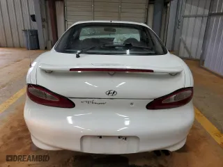 1997 Hyundai Tiburon with VIN KMHJG24M6VU052589, listed as a Copart auction lot 45118235 with 90,609 mi miles and Salvage Title. Bid and sale history available at carsss.com. Image 6.