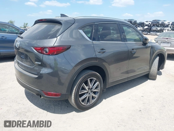 2017 Mazda CX-5 Grand Touring with VIN JM3KFADL3H0227655, listed as a IAAI auction lot 41897981 with 103,545 mi miles. Bid and sale history available at carsss.com. Image 4.