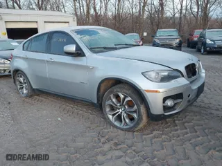 2012 BMW X6 50i with VIN 5UXFG8C58CL590171, listed as a IAAI auction lot 41087730 with 83,143 mi miles. Bid and sale history available at carsss.com. Image 1.