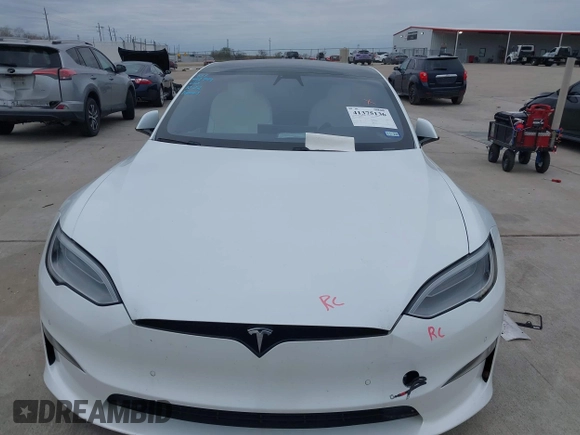 2021 Tesla Model S Plaid z VIN 5YJSA1E64MF452744, wystawiony jako IAAI lot #41375136 z przebiegiem Nie podano mil oraz . Historia ofert i sprzedaży dostępna na DreamBid. Obrazek 10.
