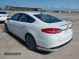 2018 Ford Fusion Titanium with VIN 3FA6P0RU3JR124007, listed as a IAAI auction lot 42207863 with 179,708 mi miles and . Bid and sale history available at DreamBid. Image 3.