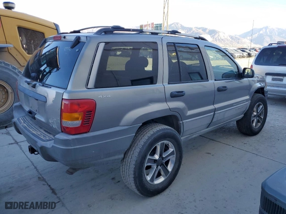 1999 Jeep Grand Cherokee Laredo with VIN 1J4GW58N9XC730311, listed as a Copart auction lot 77774544 with 0 mi miles and Salvage Title. Bid and sale history available at carsss.com. Image 3.