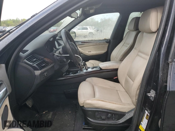 2012 BMW X5 35i z VIN 5UXZV4C5XCL748652, wystawiony jako Copart lot #55457455 z przebiegiem 149 030 mil mil oraz Szkoda całkowita • Salvage title. Historia ofert i sprzedaży dostępna na DreamBid. Obrazek 7.