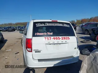 2019 Dodge Grand Caravan SXT with VIN 2C4RDGCG1KR545775, listed as a IAAI auction lot 42061287 with 131,603 mi miles and . Bid and sale history available at DreamBid. Image 16.