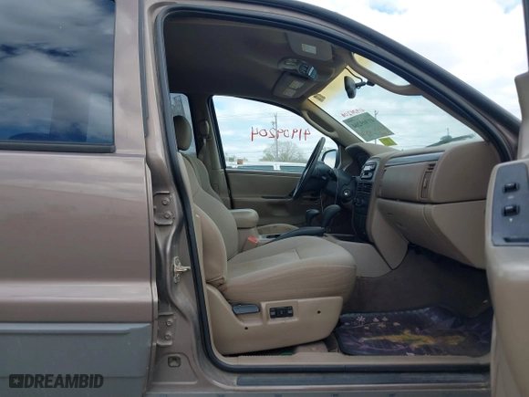 2002 Jeep Grand Cherokee Laredo with VIN 1J4GW48S32C123720, listed as a IAAI auction lot 41909204 with 157,996 mi miles. Bid and sale history available at carsss.com. Image 5.