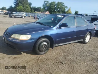 2002 Honda Accord LX with VIN 1HGCG55412A146911, listed as a Copart auction lot 68179574 with 297,080 mi miles and Salvage title. Bid and sale history available at DreamBid. Image 1.