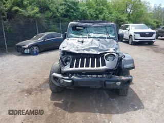 2021 Jeep Gladiator Freedom with VIN 1C6HJTAG3ML557932, listed as a IAAI auction lot 42150245 with 26,656 mi miles and . Bid and sale history available at DreamBid. Image 13.