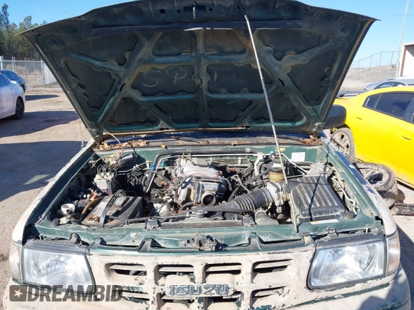 2001 Isuzu Rodeo S z VIN 4S2DM58W214322178, wystawiony jako IAAI lot #41398609 z przebiegiem 180 017 mil mil oraz . Historia ofert i sprzedaży dostępna na DreamBid. Obrazek 10.