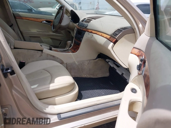 2003 Mercedes-Benz E-Class 3.2L with VIN WDBUF65J23A243178, listed as a IAAI auction lot 41974660 with 134,459 mi miles. Bid and sale history available at carsss.com. Image 5.