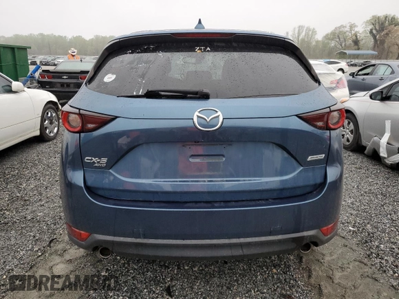 2017 Mazda CX-5 Touring with VIN JM3KFBCLXH0124451, listed as a Copart auction lot 51060275 with 126,807 mi miles and Salvage Title. Bid and sale history available at carsss.com. Image 6.