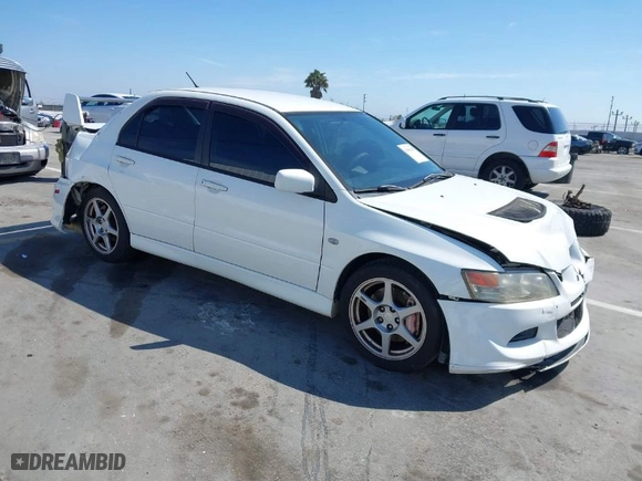 2005 Mitsubishi Lancer Evolution VIII with VIN JA3AH86DX5U054278, listed as a IAAI auction lot 41881180 with 157,497 mi miles. Bid and sale history available at carsss.com. Image 1.