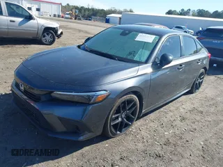 2023 Honda Civic Sport z VIN 2HGFE2F56PH503825, wystawiony jako IAAI lot #41854174 z przebiegiem 54 772 mil mil oraz . Historia ofert i sprzedaży dostępna na DreamBid. Obrazek 2.