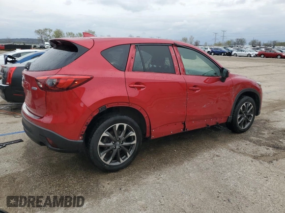2016 Mazda CX-5 Grand Touring with VIN JM3KE4DY5G0660201, listed as a Copart auction lot 52165205 with 108,231 mi miles and Salvage Title. Bid and sale history available at DreamBid. Image 3.
