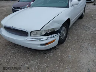 1999 Buick Park Avenue Ultra with VIN 1G4CU5217X4658627, listed as a IAAI auction lot 42013174 with 148,856 mi miles. Bid and sale history available at carsss.com. Image 6.
