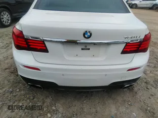2015 BMW 7 Series 750Li with VIN WBAYE8C50FD781160, listed as a IAAI auction lot 41061232 with 154,496 mi miles. Bid and sale history available at carsss.com. Image 6.