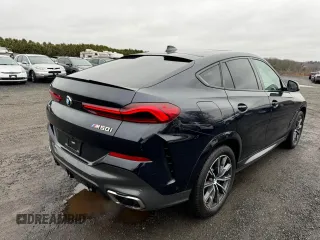 2021 BMW X6 M50i z VIN 5UXCY8C02M9D95172, wystawiony jako Copart lot #84796854 z przebiegiem 75 299 mil mil oraz Czysty tytuł • Clean title. Historia ofert i sprzedaży dostępna na DreamBid. Obrazek 3.