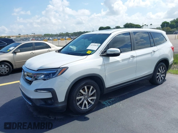 2020 Honda Pilot EX-L with VIN 5FNYF5H59LB028268, listed as a IAAI auction lot 42355620 with 107,033 mi miles and . Bid and sale history available at DreamBid. Image 2.