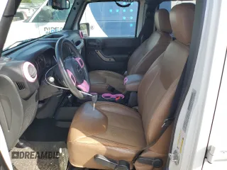 2016 Jeep Wrangler Unlimited Sahara with VIN 1C4BJWEG1GL328101, listed as a Copart auction lot 52754865 with 65,106 mi miles and Salvage title. Bid and sale history available at DreamBid. Image 7.