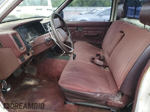 1990 Nissan Frontier z VIN 1N6SD11S8LC377906, wystawiony jako Copart lot #54840925 z przebiegiem 131 024 mil mil oraz Szkoda całkowita • Salvage title. Historia ofert i sprzedaży dostępna na DreamBid. Obrazek 7.
