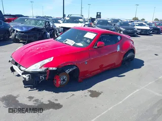 2014 Nissan 370Z Nismo with VIN JN1AZ4EH9EM636306, listed as a IAAI auction lot 41467766 with 101,021 mi miles and . Bid and sale history available at DreamBid. Image 2.