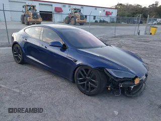 2023 Tesla Model S with VIN 5YJSA1E53PF518986, listed as a IAAI auction lot 41223046 with 22,204 mi miles and . Bid and sale history available at DreamBid. Image 1.