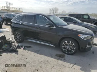 2020 BMW X1 xDrive28i with VIN WBXJG9C06L5P89796, listed as a Copart auction lot 52817235 with 95,665 mi miles and Salvage title. Bid and sale history available at DreamBid. Image 4.