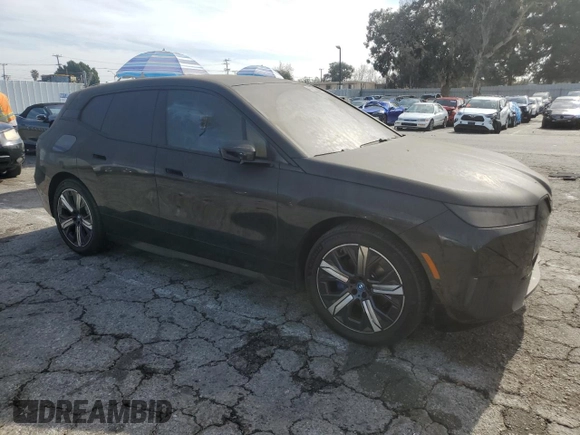 2023 BMW iX xDrive50 with VIN WB523CF0XPCL59062, listed as a Copart auction lot 43813935 with 7,788 mi miles and Salvage Title. Bid and sale history available at carsss.com. Image 4.