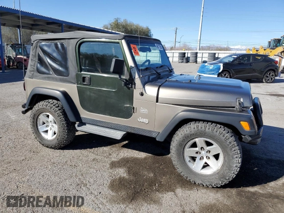 2003 Jeep Wrangler Sahara z VIN 1J4FA59S43P369233, wystawiony jako Copart lot #46517565 z przebiegiem 169 232 mil mil oraz Szkoda całkowita • Salvage title. Historia ofert i sprzedaży dostępna na DreamBid. Obrazek 4.