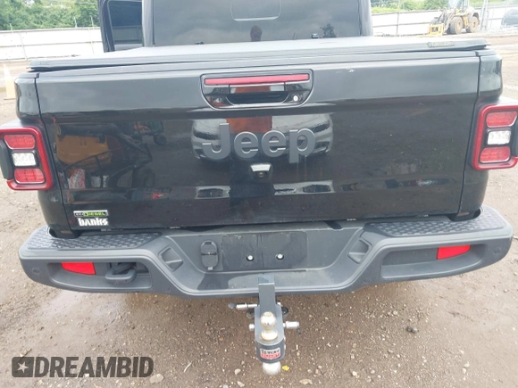 2023 Jeep Gladiator Overland with VIN 1C6JJTFM9PL593659, listed as a IAAI auction lot 42470253 with 34,374 mi miles and . Bid and sale history available at DreamBid. Image 16.