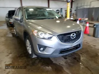 2014 Mazda CX-5 Touring z VIN JM3KE4CY5E0393463, wystawiony jako Copart lot #57776665 z przebiegiem 91 565 mil mil oraz Szkoda całkowita • Salvage title. Historia ofert i sprzedaży dostępna na DreamBid. Obrazek 13.