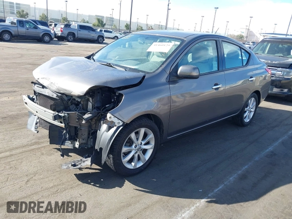 2014 Nissan Versa S with VIN 3N1CN7APXEL817010, listed as a IAAI auction lot 41460129 with 137,040 mi miles. Bid and sale history available at carsss.com. Image 2.