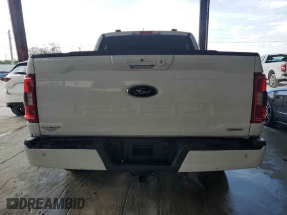 2023 Ford F-150 XL with VIN 1FTEW1CP9PKD19429, listed as a Copart auction lot 58021125 with 13,678 mi miles and Salvage title. Bid and sale history available at DreamBid. Image 6.