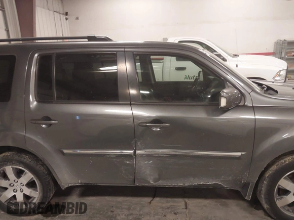 2012 Honda Pilot Touring with VIN 5FNYF4H98CB030879, listed as a IAAI auction lot 41619003 with 201,131 mi miles. Bid and sale history available at carsss.com. Image 13.